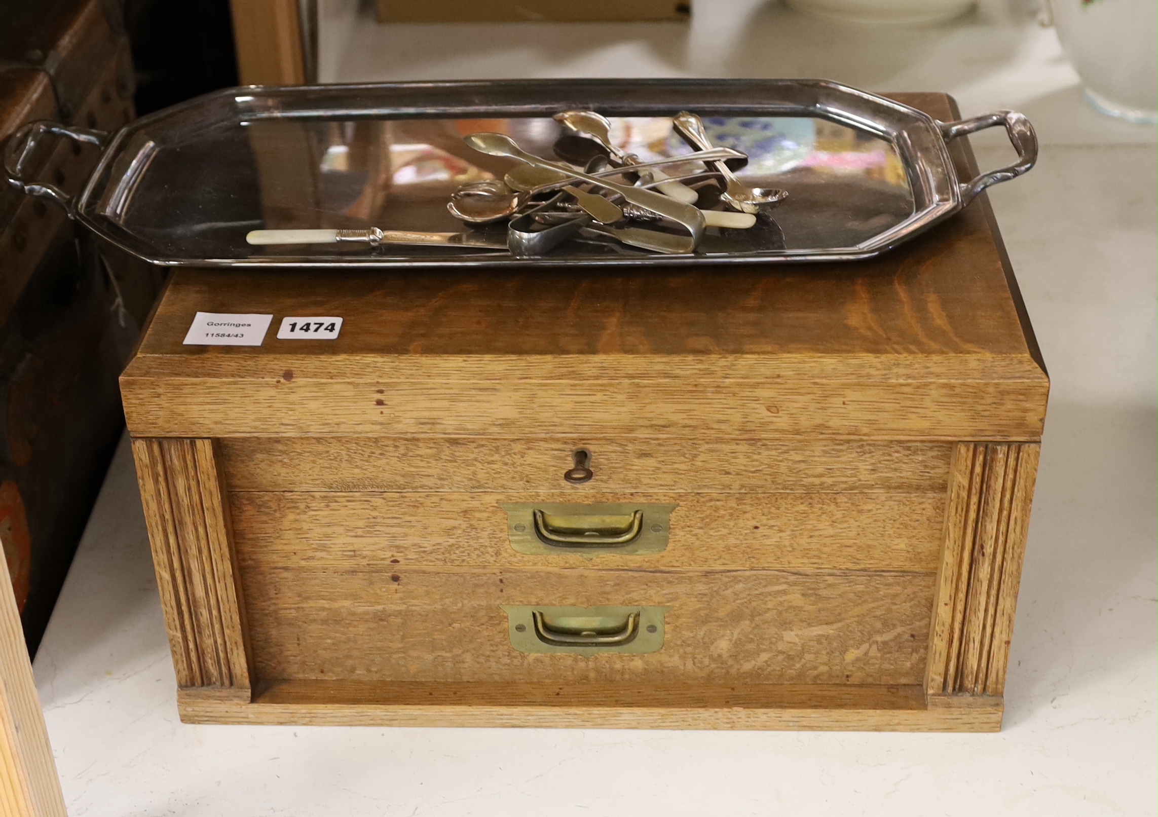 An oak cased set of twelve pair of silver plated cutlery and other plated wares